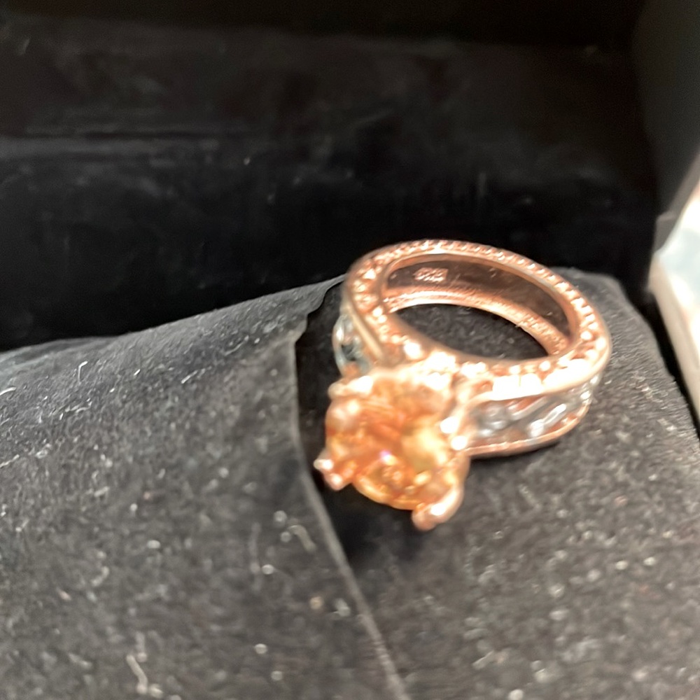 Rose gold over silver, 3 ct CZ stone. Size 5
